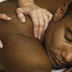 Man receiving a massage at the Interlude Spa