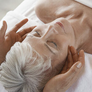 Older woman receiving a spa facial