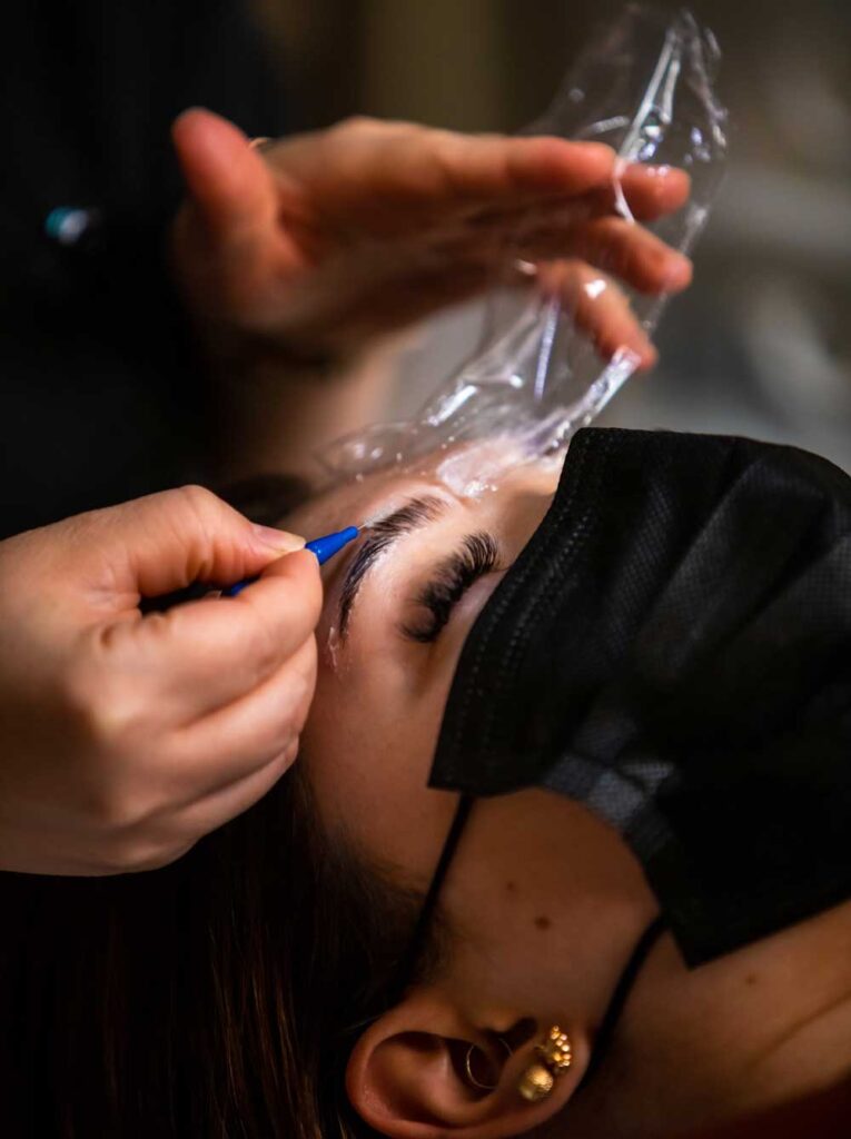 Women receiving an eye brow spa service